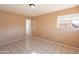 Bright bedroom with tile floor and double door closet at 4613 N 53Rd Dr, Phoenix, AZ 85031