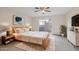 Bright bedroom with wood-toned furniture and access to patio at 4648 W Continental Dr, Glendale, AZ 85308
