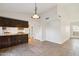 Kitchen with dark wood cabinets and tile flooring at 4648 W Continental Dr, Glendale, AZ 85308