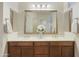 Double vanity bathroom with a large mirror at 4937 S Pulse Ter, Mesa, AZ 85212
