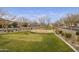Community park with playground and open green space at 4937 S Pulse Ter, Mesa, AZ 85212