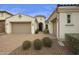 Craftsman style home with two car garage and landscaped front yard at 4937 S Pulse Ter, Mesa, AZ 85212