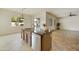 Island kitchen with dark wood cabinets and granite countertops at 4937 S Pulse Ter, Mesa, AZ 85212