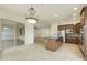 Kitchen with island, stainless steel appliances and access to backyard patio at 4937 S Pulse Ter, Mesa, AZ 85212