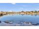Tranquil community lake reflecting the surrounding homes at 4937 S Pulse Ter, Mesa, AZ 85212
