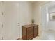 Bright laundry room with wooden cabinets and countertop at 4937 S Pulse Ter, Mesa, AZ 85212