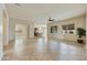 Open and spacious living area with tile flooring and ceiling fan at 4937 S Pulse Ter, Mesa, AZ 85212
