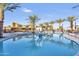 Community pool with basketball hoop and lounge chairs at 4937 S Pulse Ter, Mesa, AZ 85212