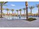 Community resort-style pool with lounge chairs at 4937 S Pulse Ter, Mesa, AZ 85212