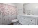 Clean bathroom with shower and floral shower curtain at 507 S Sand Verbena Way, Mesa, AZ 85208