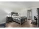 Spacious bedroom with a gray dresser and patio access at 507 S Sand Verbena Way, Mesa, AZ 85208