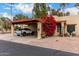 Covered parking and vibrant bougainvillea enhance curb appeal at 507 S Sand Verbena Way, Mesa, AZ 85208