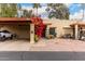 This home features a covered carport and beautiful landscaping at 507 S Sand Verbena Way, Mesa, AZ 85208