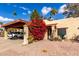 Desert landscaping and covered parking highlight this charming home's exterior at 507 S Sand Verbena Way, Mesa, AZ 85208