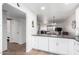 Modern kitchen with white cabinets, dark counters, and a view of the dining area at 507 S Sand Verbena Way, Mesa, AZ 85208