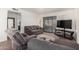 Living room with two comfy sofas and a large TV at 507 S Sand Verbena Way, Mesa, AZ 85208