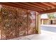 Covered patio with seating area, offering a relaxing outdoor space at 507 S Sand Verbena Way, Mesa, AZ 85208