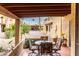 Covered patio with table and chairs, overlooking the complex at 507 S Sand Verbena Way, Mesa, AZ 85208