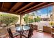 Covered patio with seating area and courtyard view at 507 S Sand Verbena Way, Mesa, AZ 85208