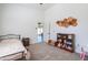 Charming bedroom featuring a bed and built-in shelves at 55091 W Pima Rd, Maricopa, AZ 85139