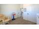 Playroom with rocking chair and basketball hoop at 55091 W Pima Rd, Maricopa, AZ 85139