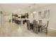 Bright dining room with wooden table and chairs, adjacent to kitchen at 5633 S Crowley --, Mesa, AZ 85212