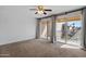 Bedroom with patio access and neutral carpeting at 6501 N 17Th Ave # 112, Phoenix, AZ 85015
