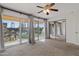 Bright bedroom with mirrored closet and access to patio at 6501 N 17Th Ave # 112, Phoenix, AZ 85015