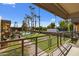 View from patio shows pool, grassy area, and palm trees at 6501 N 17Th Ave # 112, Phoenix, AZ 85015