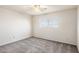 Bright bedroom with ceiling fan and grey carpeting at 6623 S La Rosa Dr, Tempe, AZ 85283