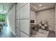 Bright home office with a built-in desk and sliding glass partition at 6803 E Main St # 1110, Scottsdale, AZ 85251