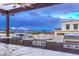 Modern outdoor kitchen with multiple grills and city views at 6803 E Main St # 1110, Scottsdale, AZ 85251