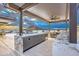 Modern outdoor kitchen with marble countertops and stainless steel grills at 6803 E Main St # 1110, Scottsdale, AZ 85251