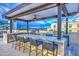 Upscale outdoor kitchen with marble countertops and bar seating at 6803 E Main St # 1110, Scottsdale, AZ 85251