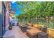 Private patio with seating area and fire pit at 6803 E Main St # 1110, Scottsdale, AZ 85251