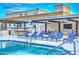 Resort-style pool area with lounge chairs and building view at 6803 E Main St # 1110, Scottsdale, AZ 85251