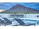 Stunning pool bar with mountain views and barstools at 6803 E Main St # 1110, Scottsdale, AZ 85251