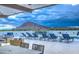 Luxury pool deck with lounge chairs and mountain views at 6803 E Main St # 1110, Scottsdale, AZ 85251