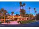 Spanish style home with palm trees and landscaping at dusk at 7155 E Oakmont Dr, Paradise Valley, AZ 85253