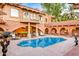 Resort-style backyard oasis featuring a large pool at 7155 E Oakmont Dr, Paradise Valley, AZ 85253