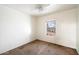 Bright bedroom featuring carpeted floors and a window view at 7223 S 41St Ln, Phoenix, AZ 85041