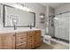 Double vanity bathroom with hexagon tile shower and modern fixtures at 7446 S 30Th Run, Phoenix, AZ 85042