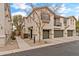 Two story townhome with attached two car garage, walkway and small front yard at 7446 S 30Th Run, Phoenix, AZ 85042