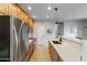 Modern kitchen with stainless steel appliances and wood cabinetry at 7446 S 30Th Run, Phoenix, AZ 85042