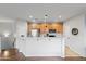 Modern kitchen with wood cabinets, stainless steel appliances, and an island at 7446 S 30Th Run, Phoenix, AZ 85042
