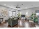Open living area with wood floors and large windows at 7446 S 30Th Run, Phoenix, AZ 85042