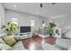 Open living room showcasing hardwood floors and a modern aesthetic at 7446 S 30Th Run, Phoenix, AZ 85042