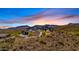 Stunning sunset view of modern home on mountainside at 7450 E Continental Mountain Dr # 5, Cave Creek, AZ 85331