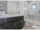 Bathroom features dark vanity, quartz countertop, and a glass shower at 7450 E Continental Mountain Dr # 5, Cave Creek, AZ 85331