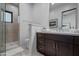 Bathroom with dark vanity, quartz countertop, and a walk-in shower at 7450 E Continental Mountain Dr # 5, Cave Creek, AZ 85331